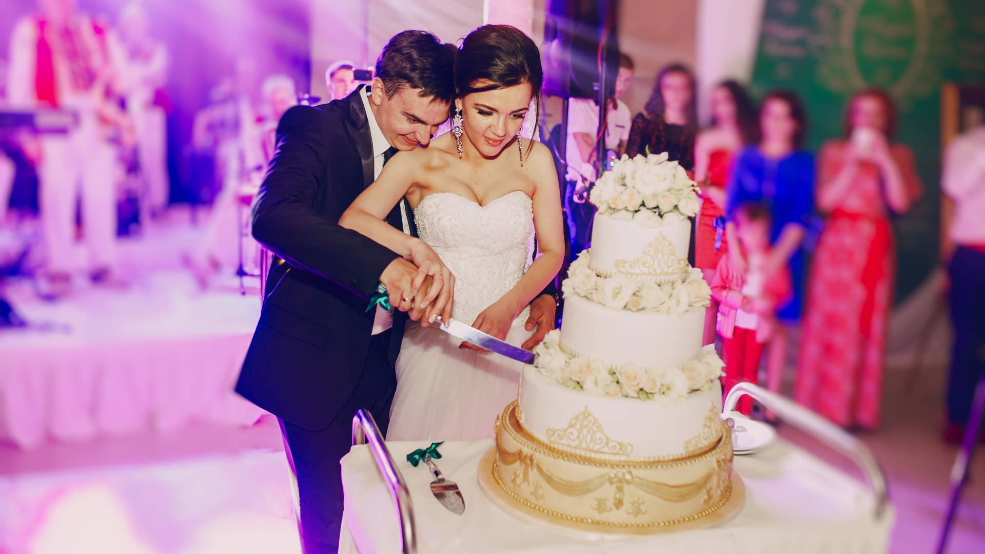 couple cutting wedding cake