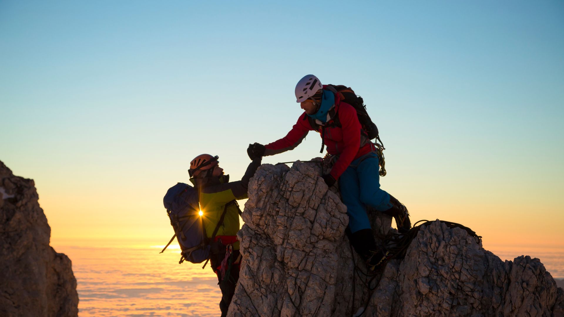 couple on rock climbing